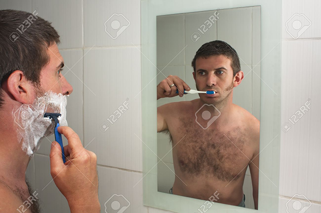 9483434-Male-figure-multi-tasking-shaving-and-brushing-teeth-in-reflection-in-mirror-Stock-Photo