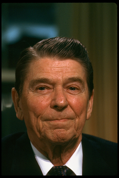 Closeup portrait of President Ronald Reagan sitting at desk in the Oval Office of the White House after adressing the nation, re Iran-Contra affair.  (Photo by Diana Walker//Time Life Pictures/Getty Images)